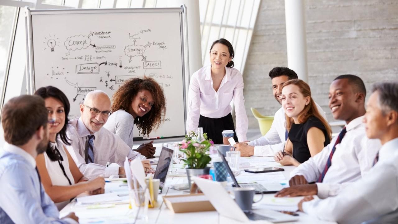 Team members in a meeting discussing project plans and communicating clearly